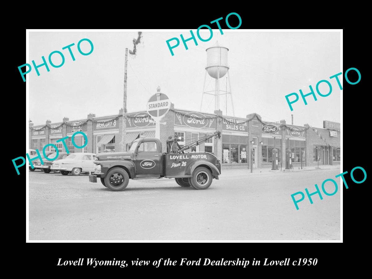 OLD LARGE HISTORIC PHOTO OF LOVELL WYOMING, THE FORD MOTOR DEALERSHIP STORE 1950