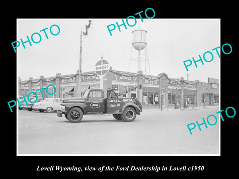 OLD LARGE HISTORIC PHOTO OF LOVELL WYOMING, THE FORD MOTOR DEALERSHIP STORE 1950