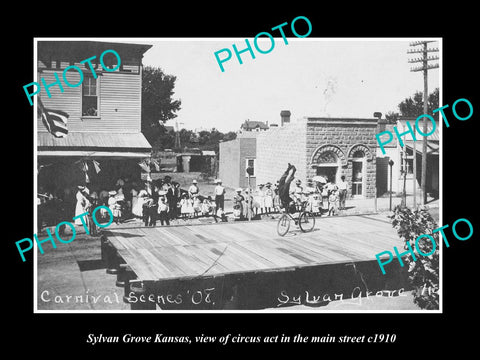 OLD LARGE HISTORIC PHOTO OF SYLVAN GROVE KANSAS, THE CIRCUS ACT IN MAIN St c1910