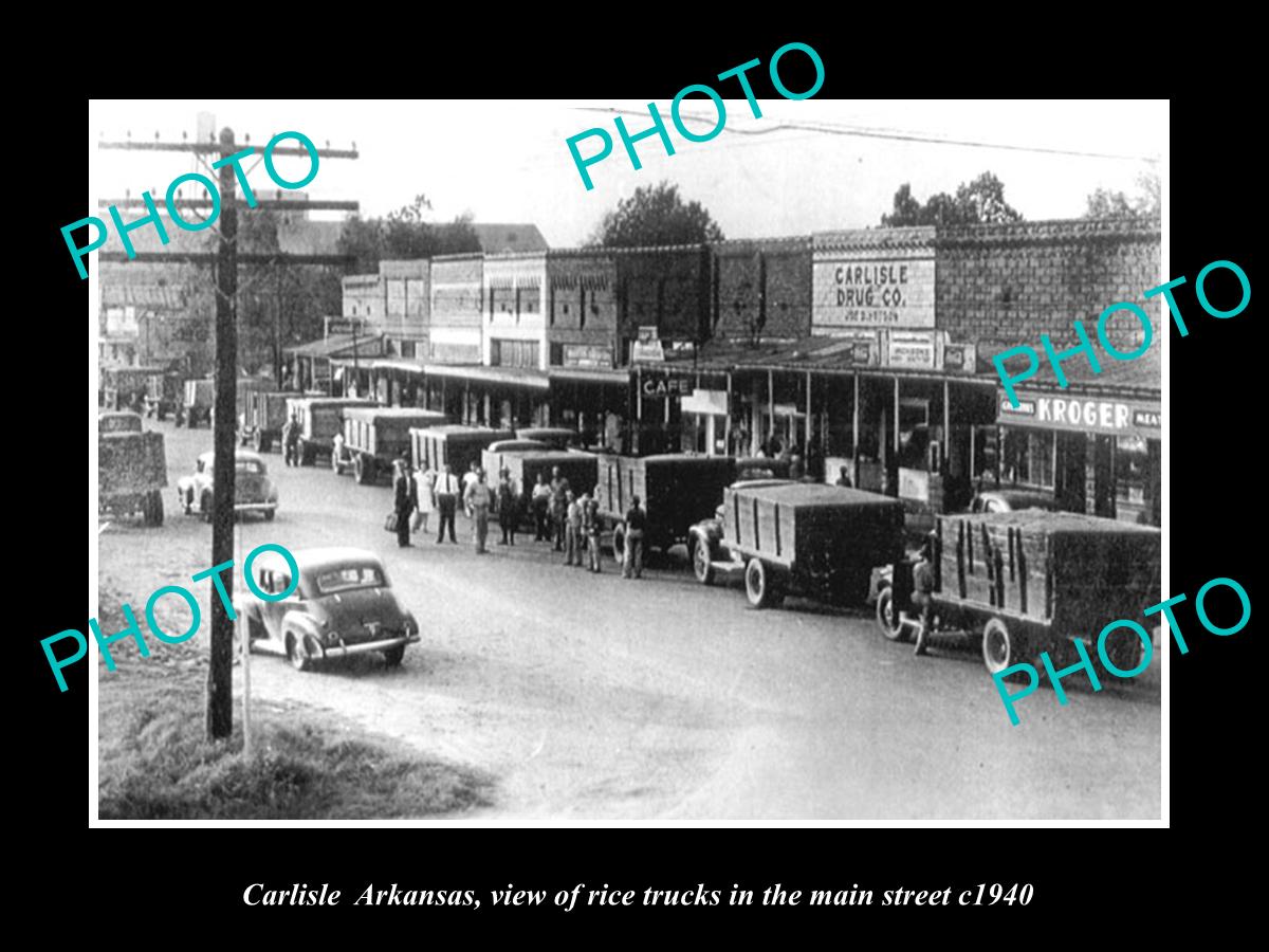 OLD LARGE HISTORIC PHOTO OF CARLISLE ARKANSAS, THE RICE TRUCKS IN MAIN ST c1940