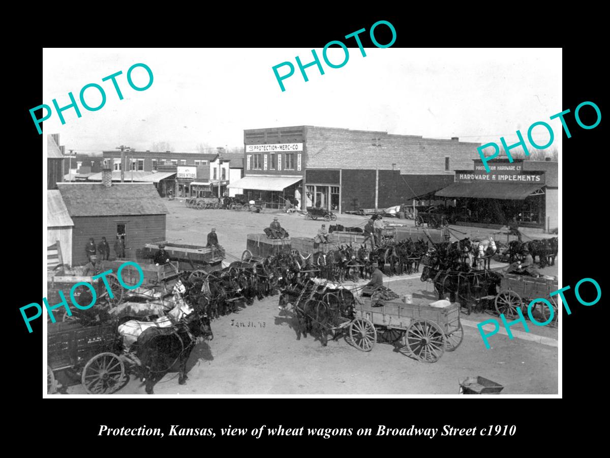 OLD LARGE HISTORIC PHOTO OF PROTECTION KANSAS, THE WAGONS ON BROADWAY St c1910